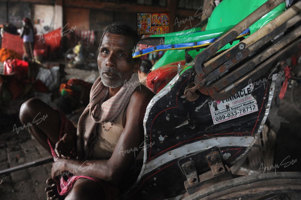16 A Rickshaw Pullers Waiting in the Stand Close to Howrah Bridge, 2016